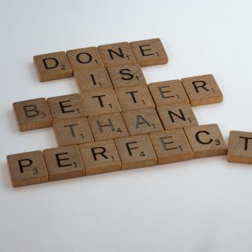 Scrabble tiles reading "Done is better than perfect"